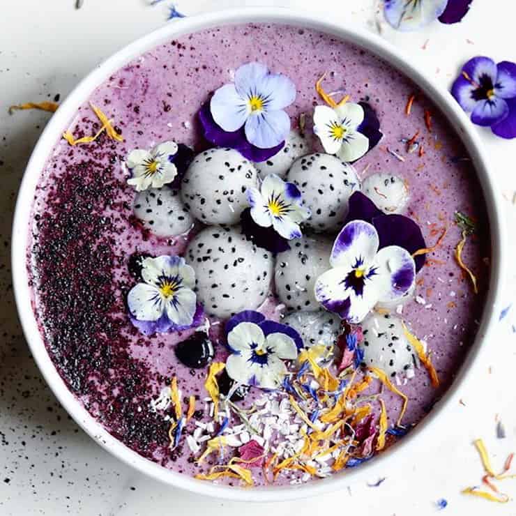 Blueberry Smoothie Bowl With Dragon Fruit And Edible Flowers